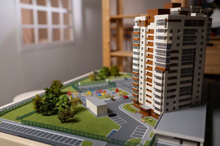 Apartment building for sale in Vellore, showing modern flats and villa plot.