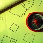 Compass on architectural plans for Vaastu plot planning
